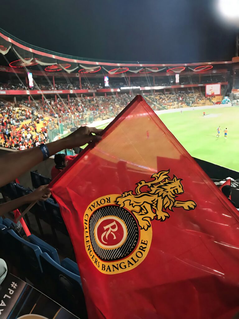 RCB Fans in stadium with flags