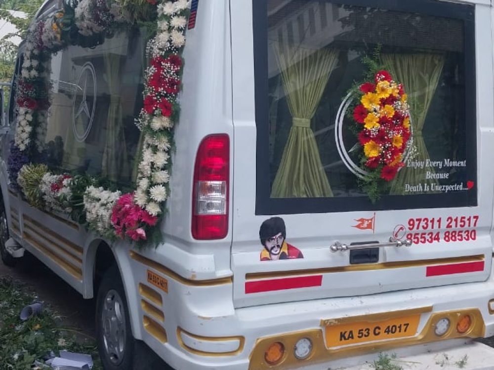 Hearse van with decorations included in funeral services package and cremation service package